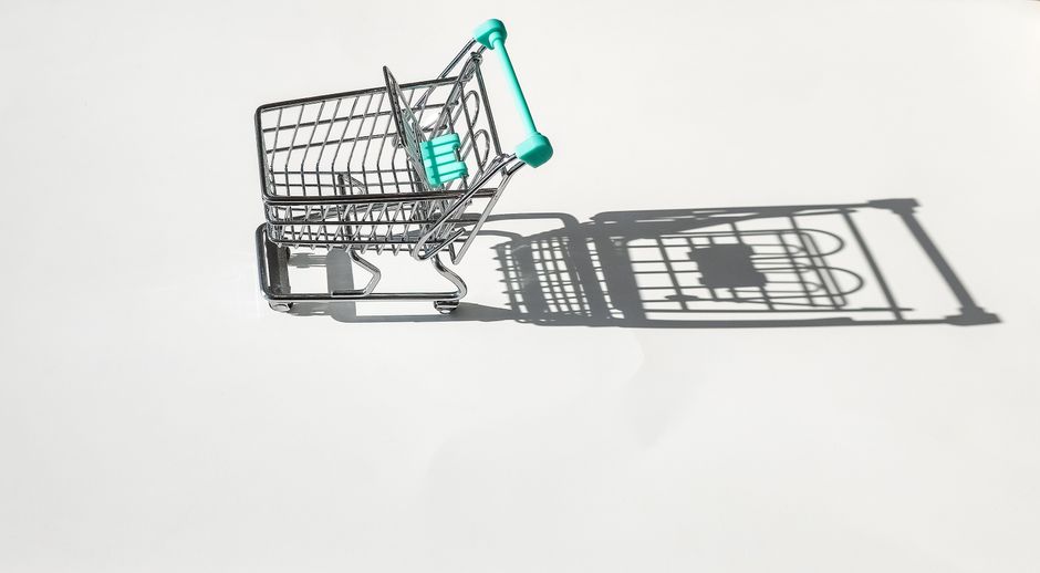 Graphic showing a shrinking shopping basket representing reduced purchasing power.