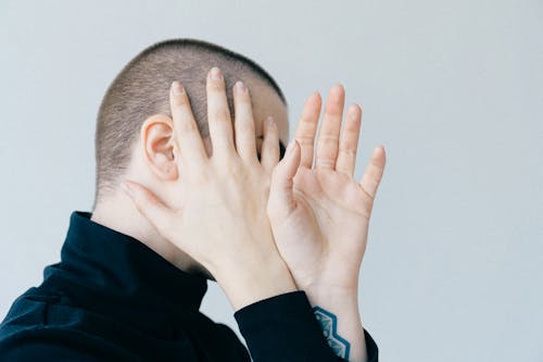 Free Woman Covering Her Face Stock Photo