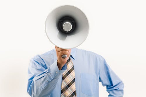 Free Man Holding a Megaphone Stock Photo