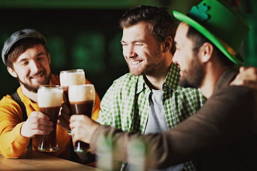 Man In Green And White Plaid Button Up Shirt Holding Drinking Glass