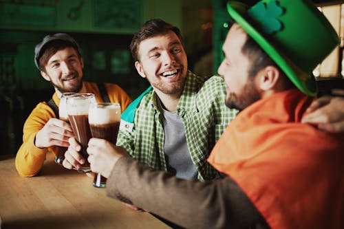 Free Friends Holding Glasses of Beer Stock Photo