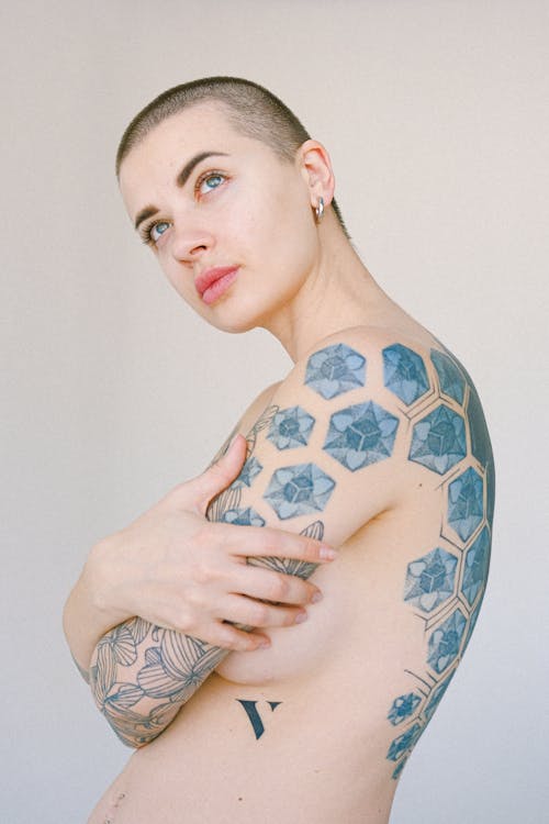 Androgynous model with tattooed body