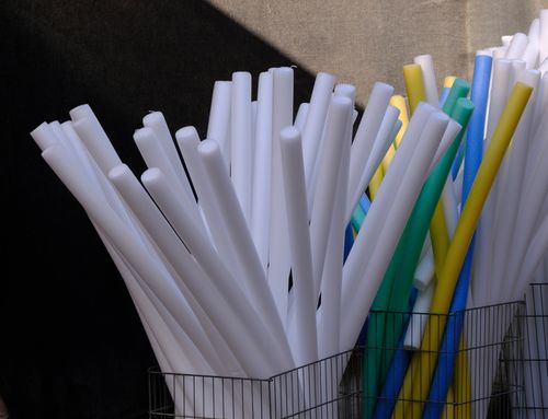Free Collection of colorful foam tubes stored in a wire basket outdoors in İzmir, Türkiye. Stock Photo