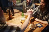 Men Arm Wrestling at a Bar