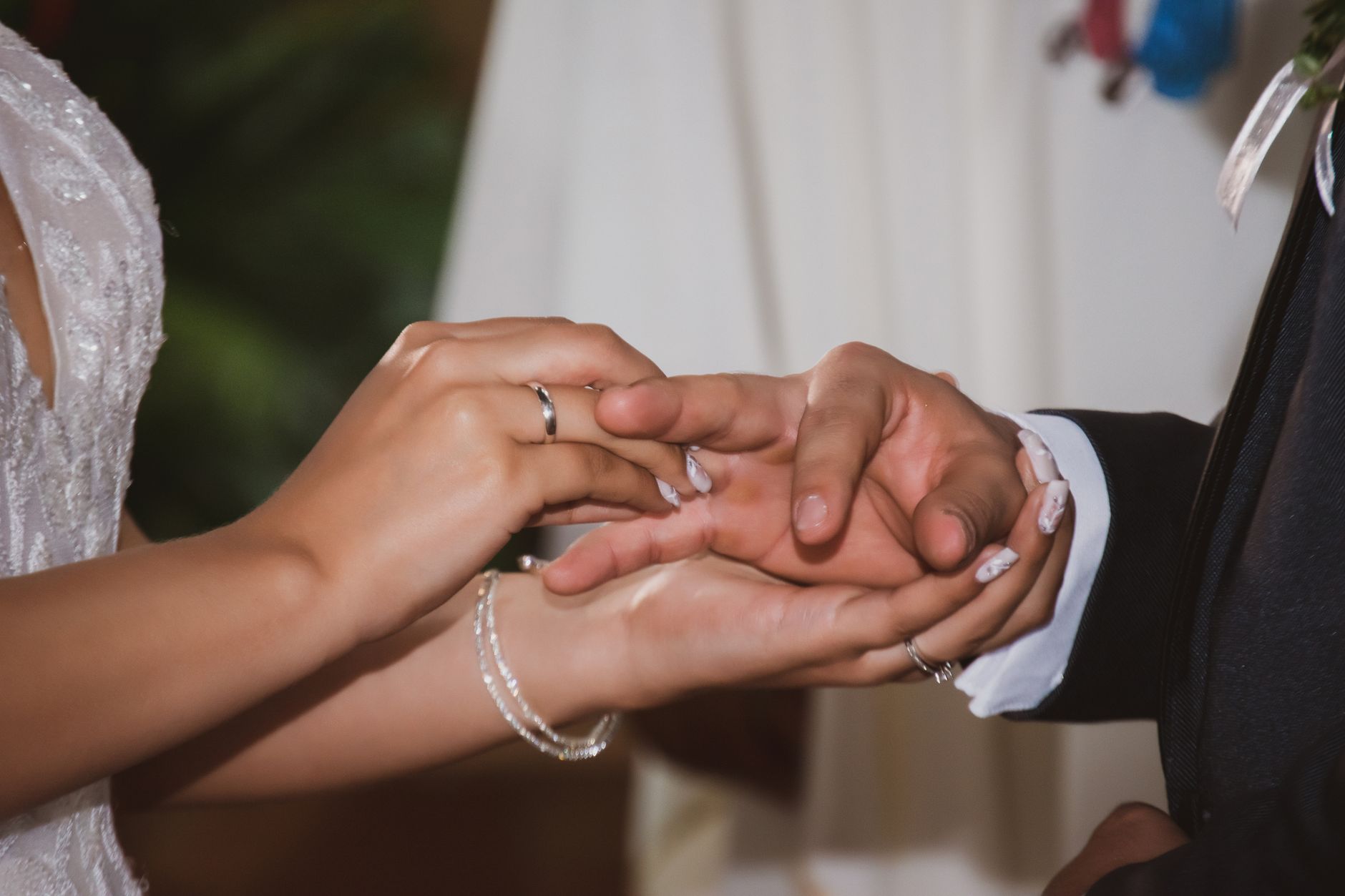 luxury wedding venues north coast egypt — Close-up of hands exchanging rings in a wedding ceremony, capturing love and commit