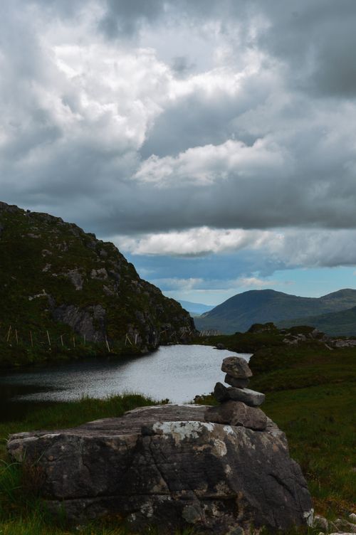 Free Beautiful Irish landscape with mountains, lake and cloudy sky, creating a serene natural view. Stock Photo