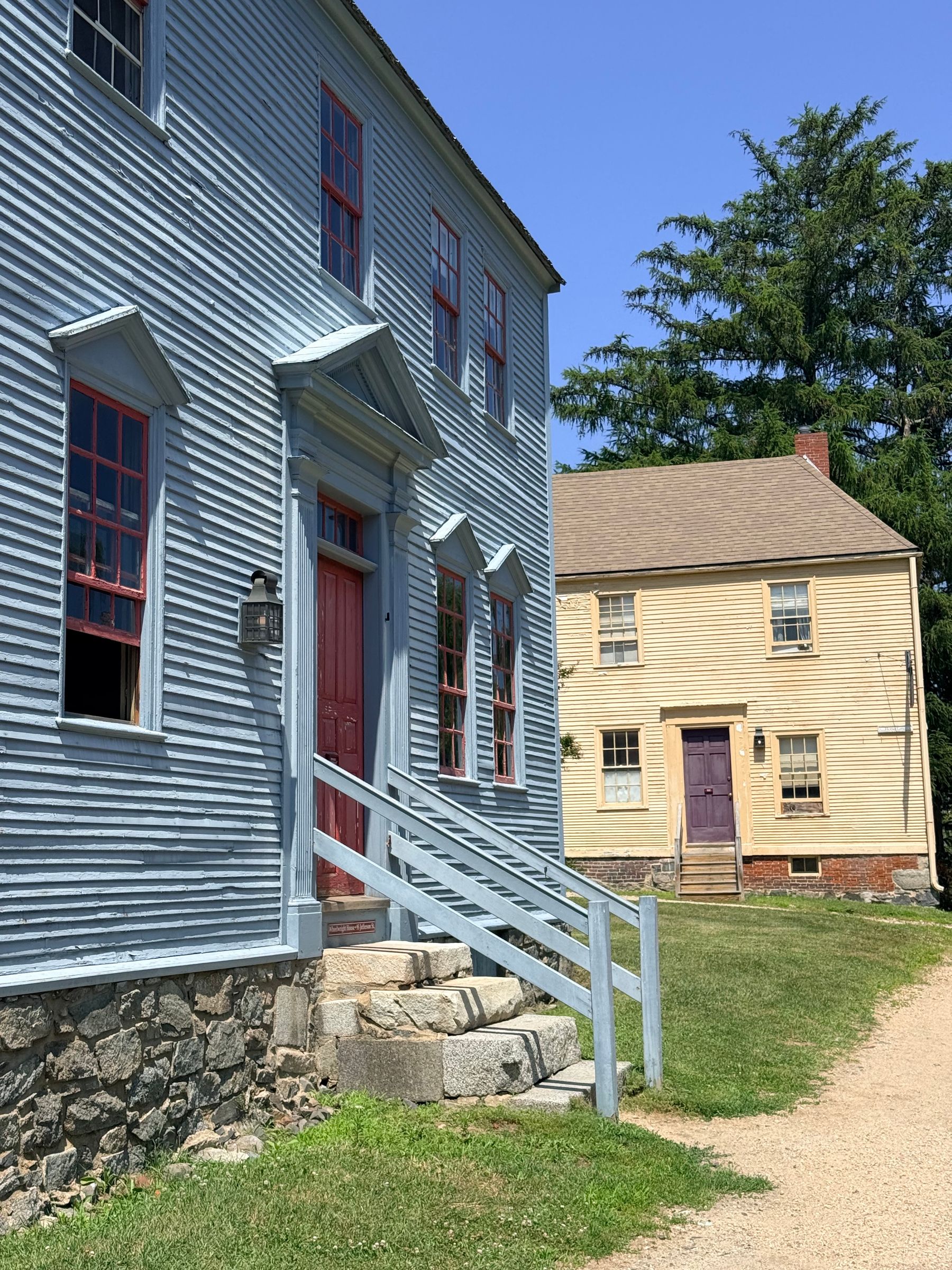 Historic colonial-style houses on a sunny day in New Hampshire.