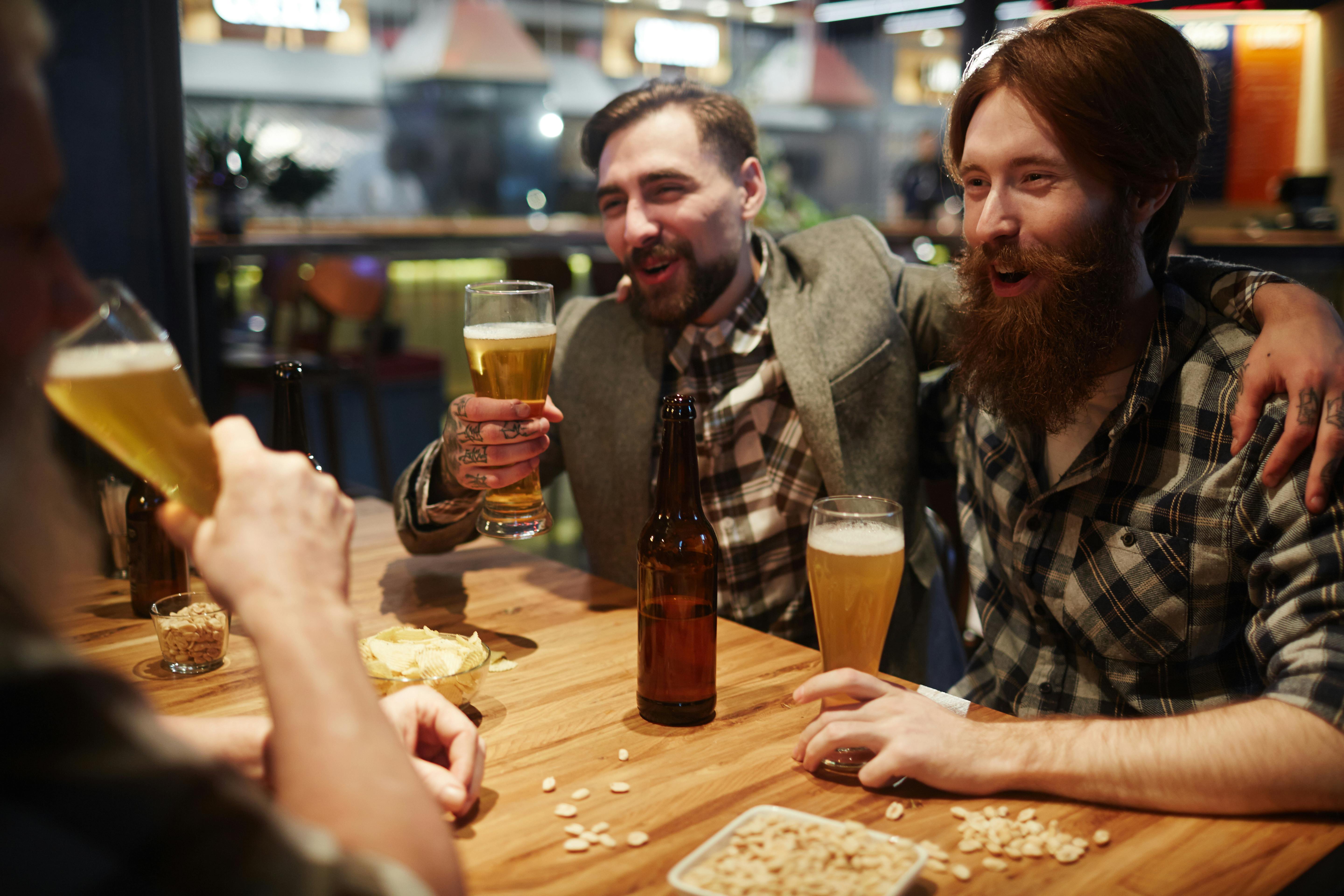 Friends Talking at a Bar · Free Stock Photo