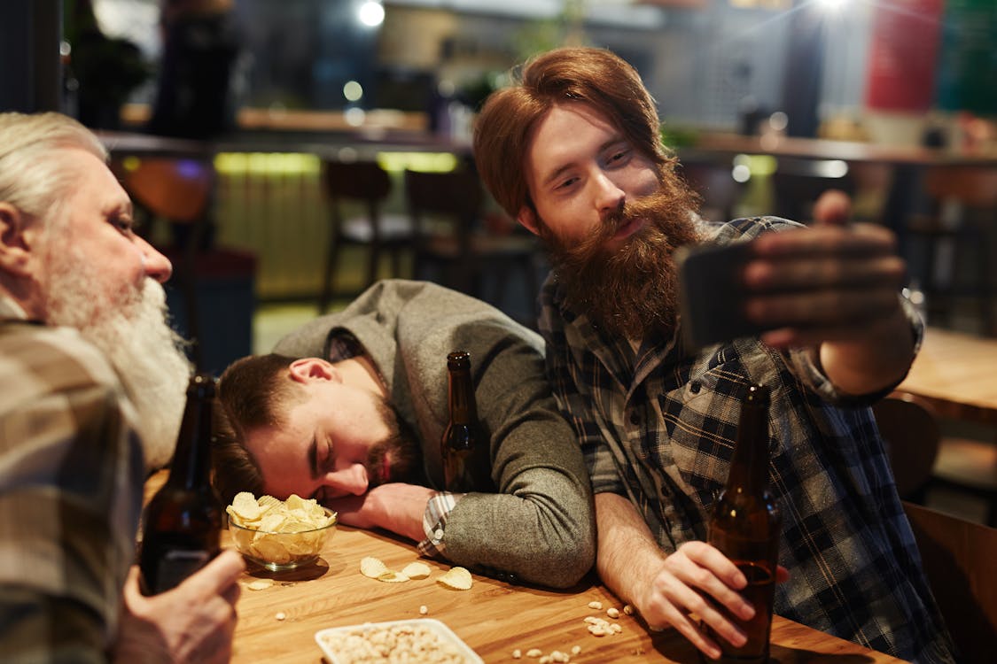 Man Taking A Selfie With A Drunk Man