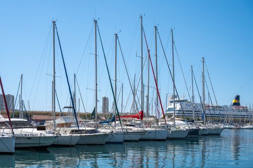 Free Scenic view of sailboats at Toulon Marina, Provence, under a clear blue sky. Stock Photo