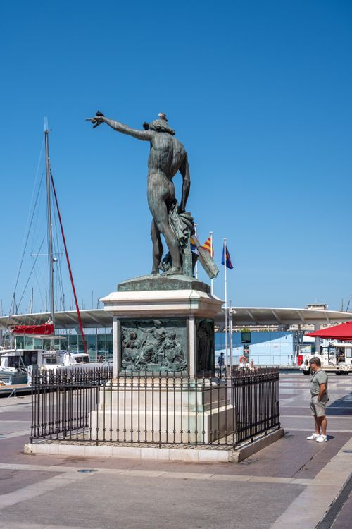Free Historical statue at Toulon harbor with marina view in Provence, France. Stock Photo