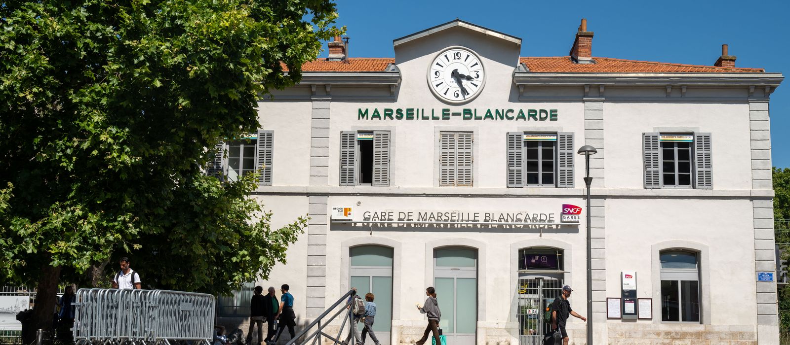People walking in front of Gare de Marseille-Blancarde, a historic railway station in Marseille, France. — flights from Bordeaux to Marseille