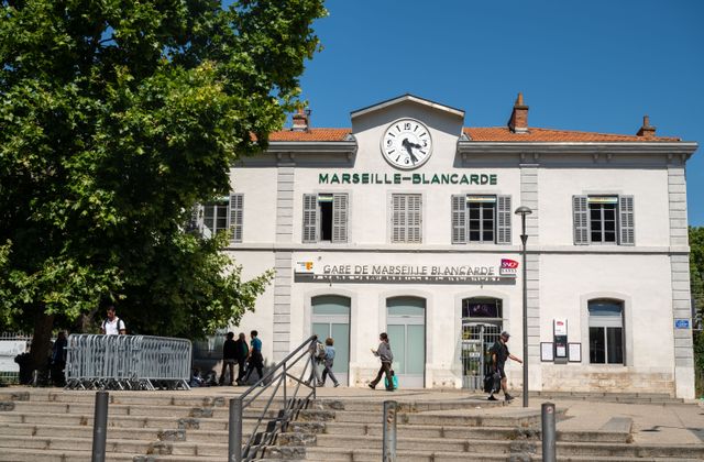 People walking in front of Gare de Marseille-Blancarde, a historic railway station in Marseille, France. — arriving in Marignane, Bouches-du-Rhône