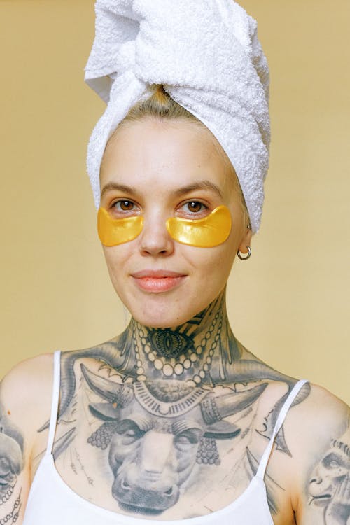 Woman In White Tank Top With White Towel On Head