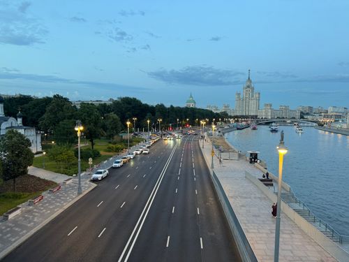 Free A serene evening view of Kotelnicheskaya Embankment Building by a river in Moscow, Russia. Stock Photo