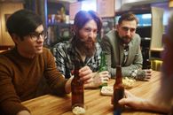 Friends With Beers at a Bar