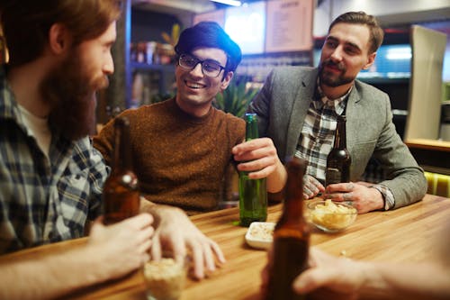 Free Friends Talking at a Bar Stock Photo