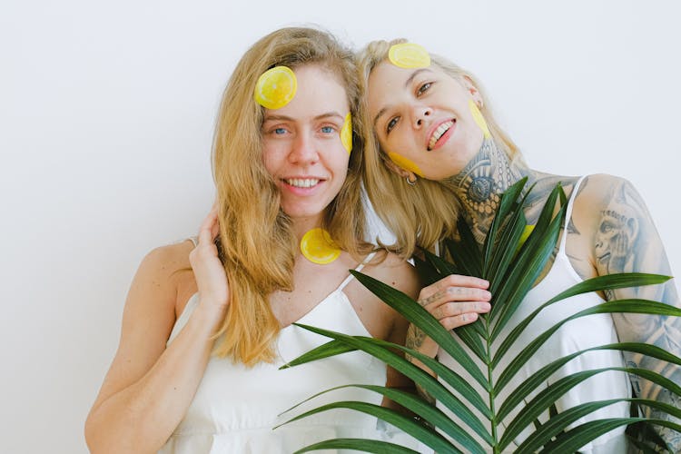 Positive Smiling Women Standing With Stickers On Face