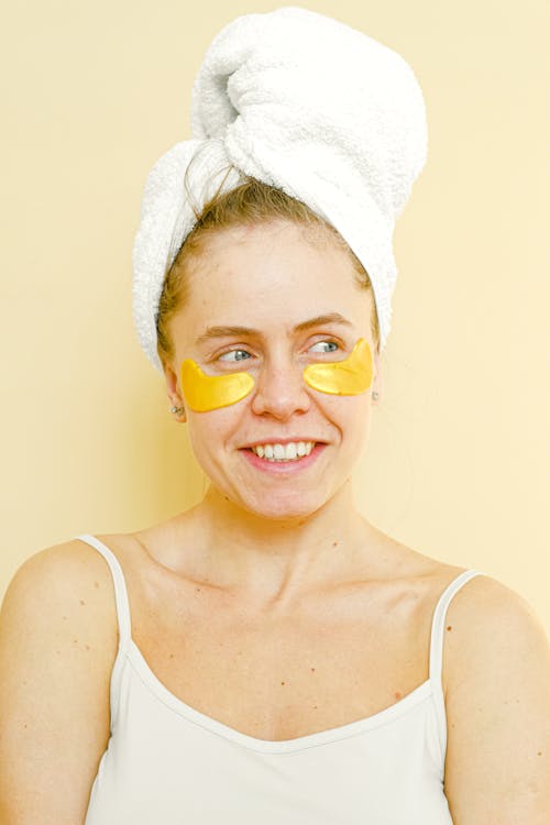 Free Young woman with eyes cosmetic patches on face Stock Photo