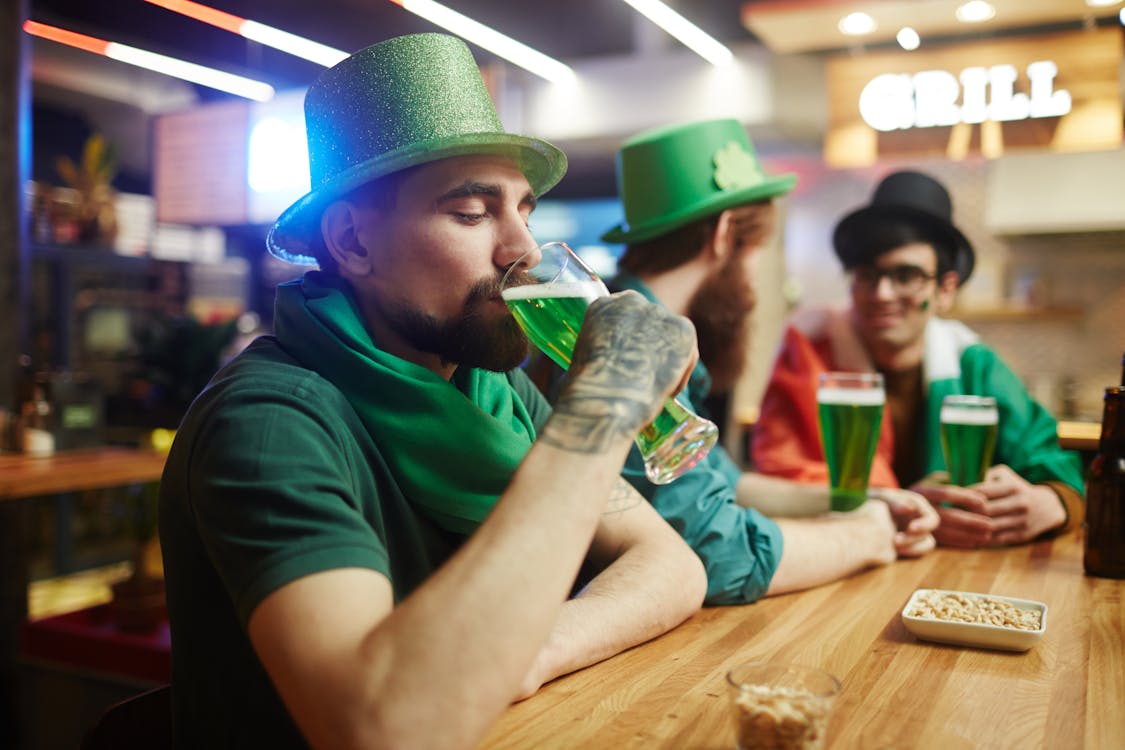 Free Man Drinking Green Beer Stock Photo