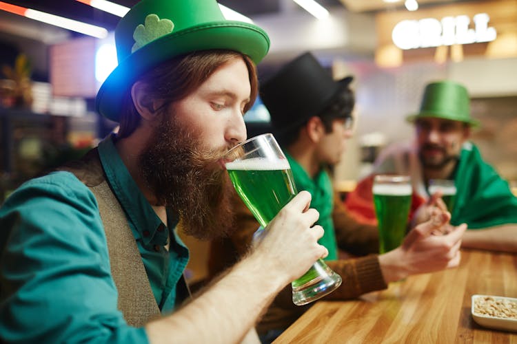 Man In Green Shirt Drinking Green Beer