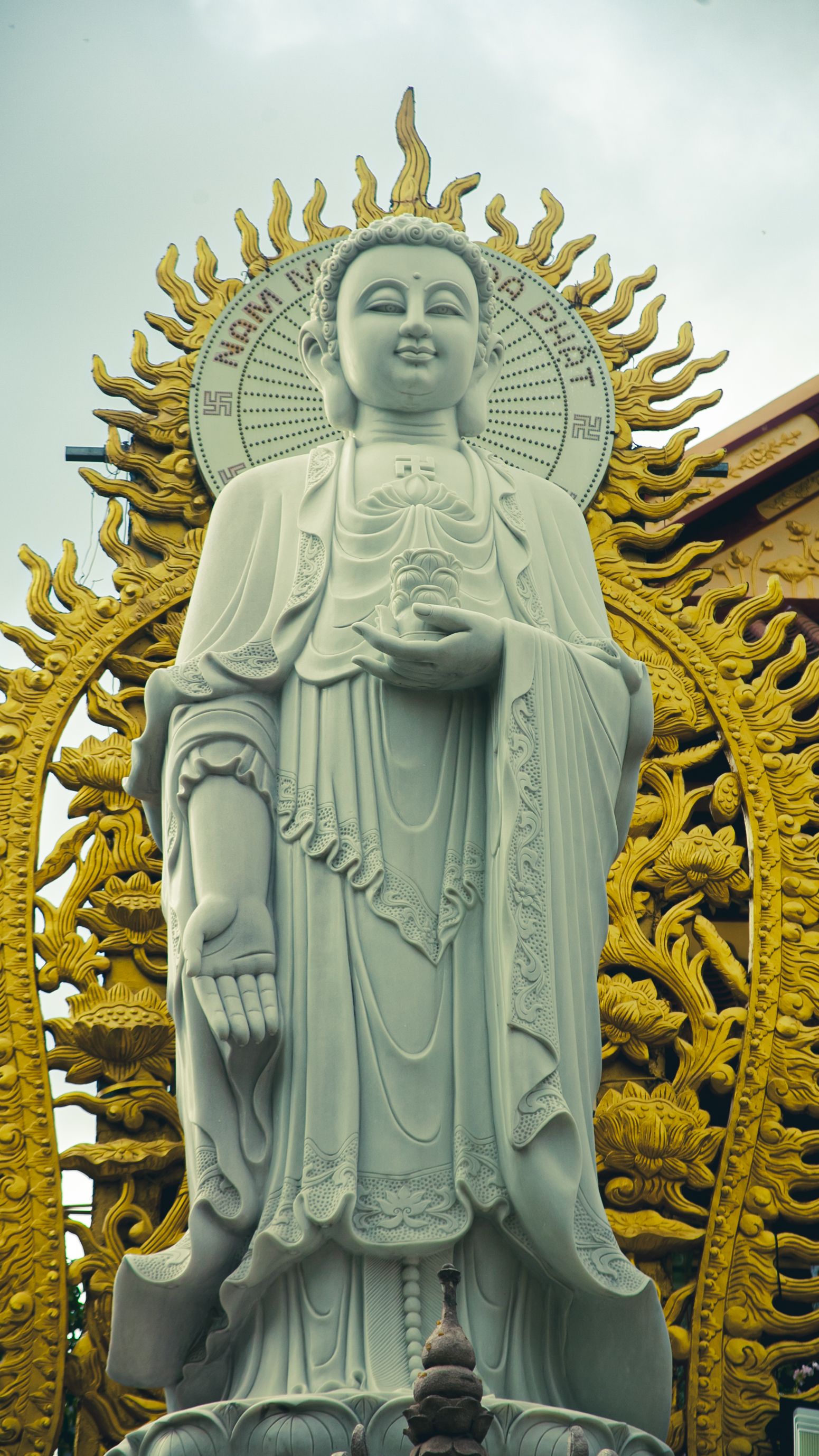 A stunning Buddhist statue with intricate details in Ho Chi Minh City, Vietnam, exemplifying religious artistry.