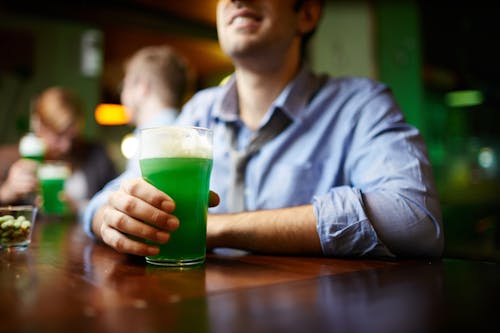 Man in Shirt Holding Green Beer