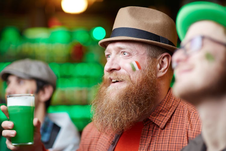 Man In Fedora Hat With Drink In Hand