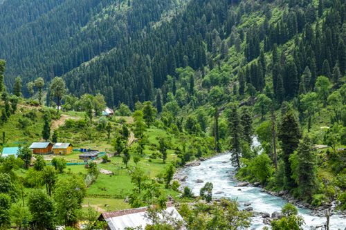 Free Breathtaking landscape of a river flowing through lush green valleys in Kashmir, India. Stock Photo