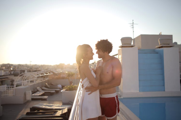 Happy Couple Cuddling Near Swimming Pool On Summer Vacation