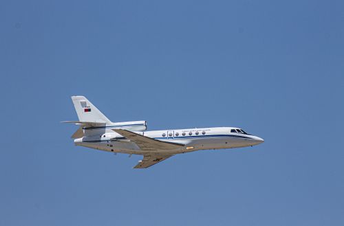 Free A private jet soars through the clear blue sky over São Brissos, Beja, Portugal, showcasing aviation elegance. Stock Photo