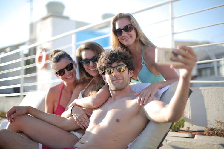 Group Of Happy Friends Taking Selfie On Smartphone Near Pool In Summertime