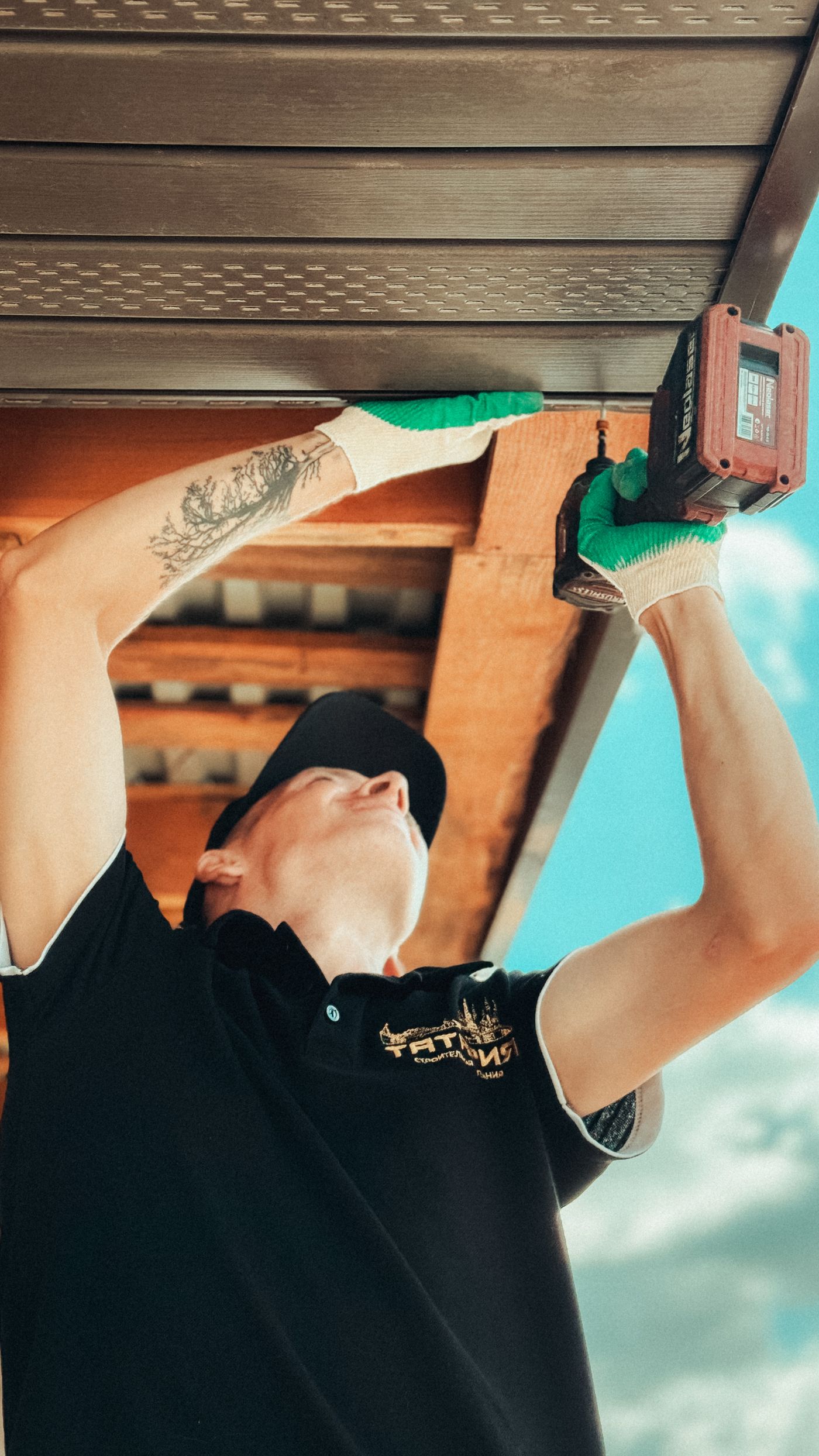 Roofing professional repairing a residential roof