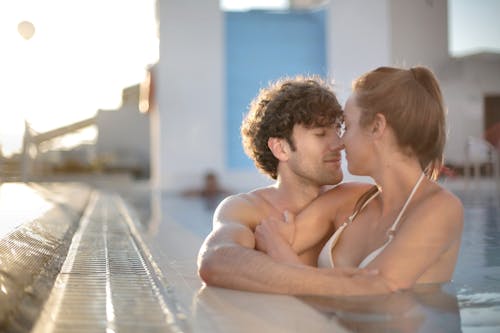 Free Man And Woman In The Pool Stock Photo