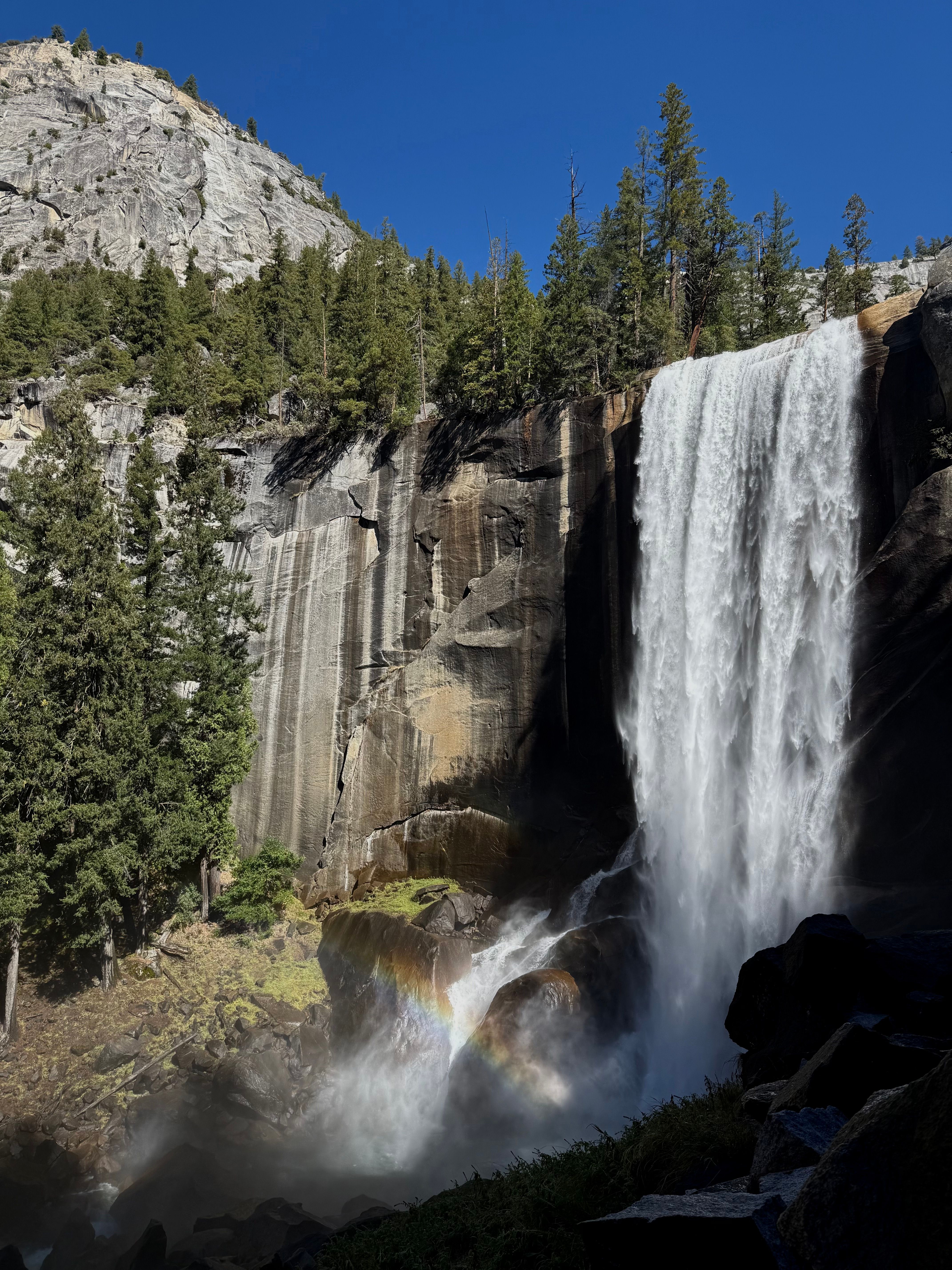 Breathtaking waterfall and rainbow in Yosemite, California.