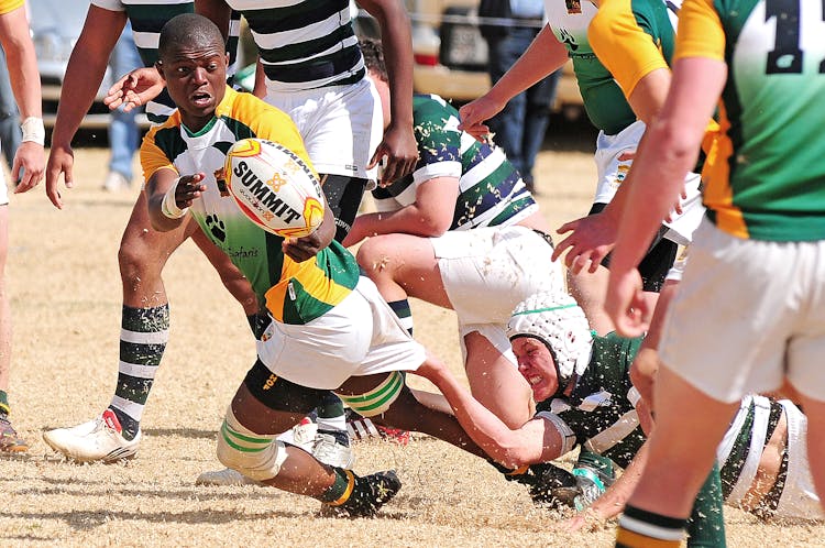 People Playing Rugby Game