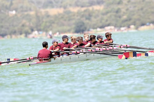 People Riding A Boat