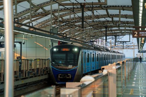 Free A modern MRT train at a Jakarta station, showcasing urban infrastructure and transportation. Stock Photo