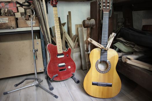 Handmade guitars placed on floor