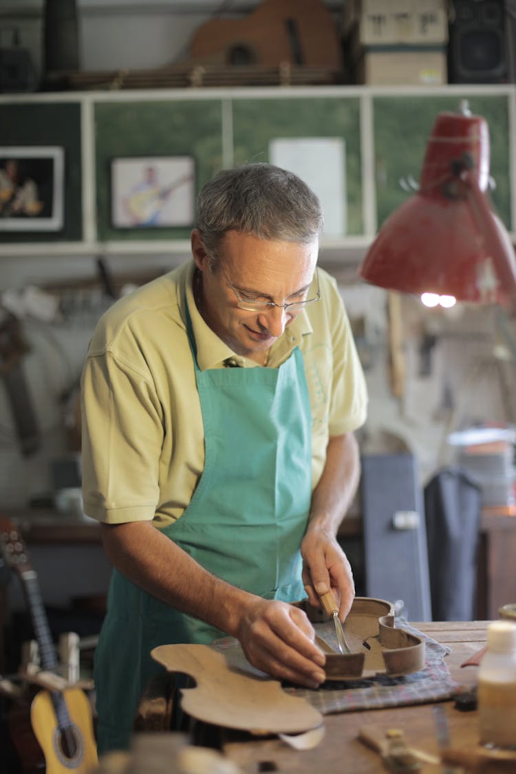 Male Master Honing Shape Of Violin