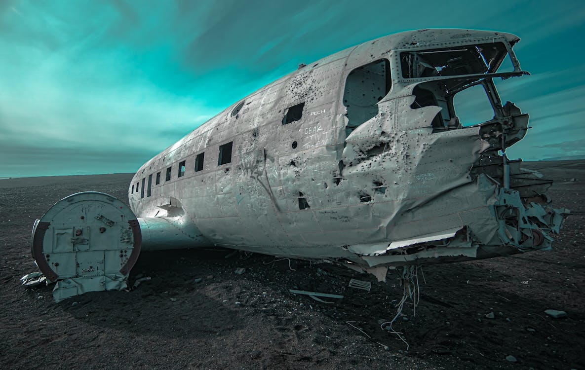 Free Wrecked White Airplane on Gray Sand Stock Photo