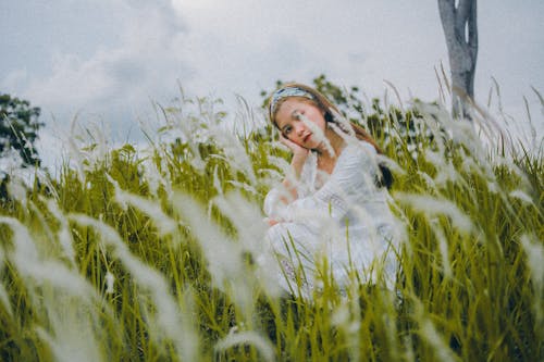 Free Charming Asian woman on green meadow Stock Photo