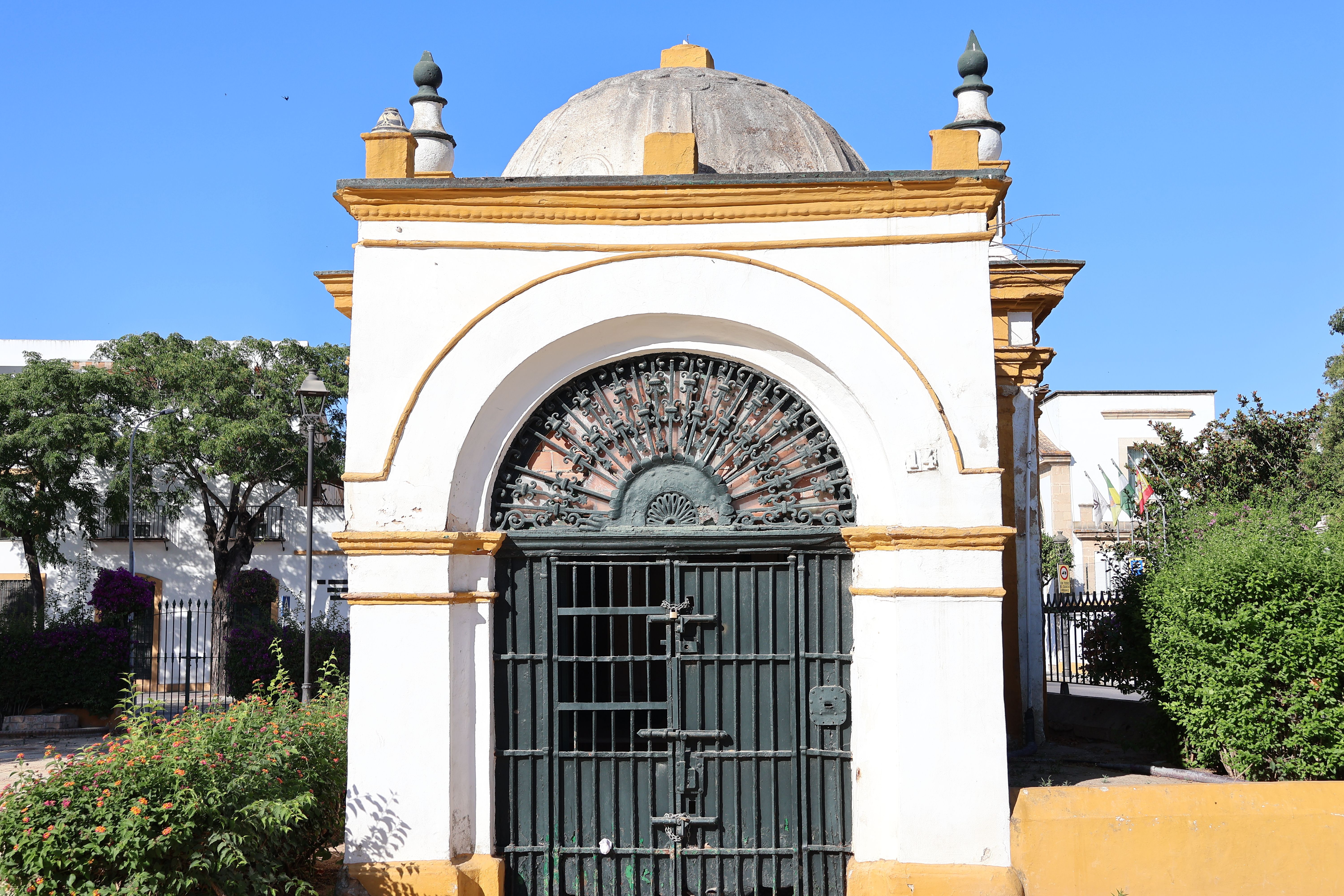 A picturesque historic chapel in El Puerto de Santa María, Spain, showcasing classic Andalusian architecture.
