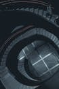 Dark spiral staircase flight in modern building