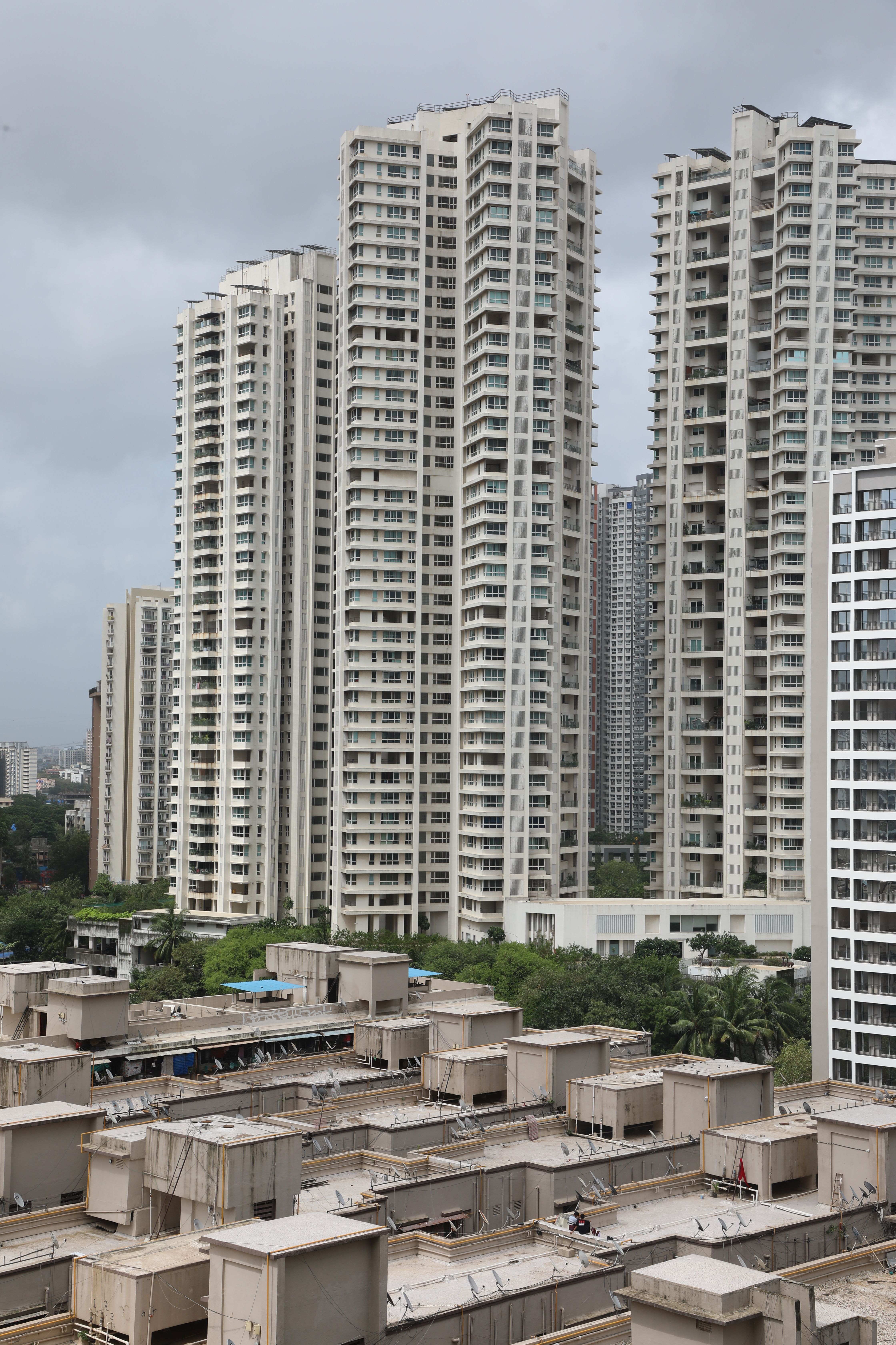 Residential high-rise towers under an overcast sky — photo by aksinfo7 universe on Pexels