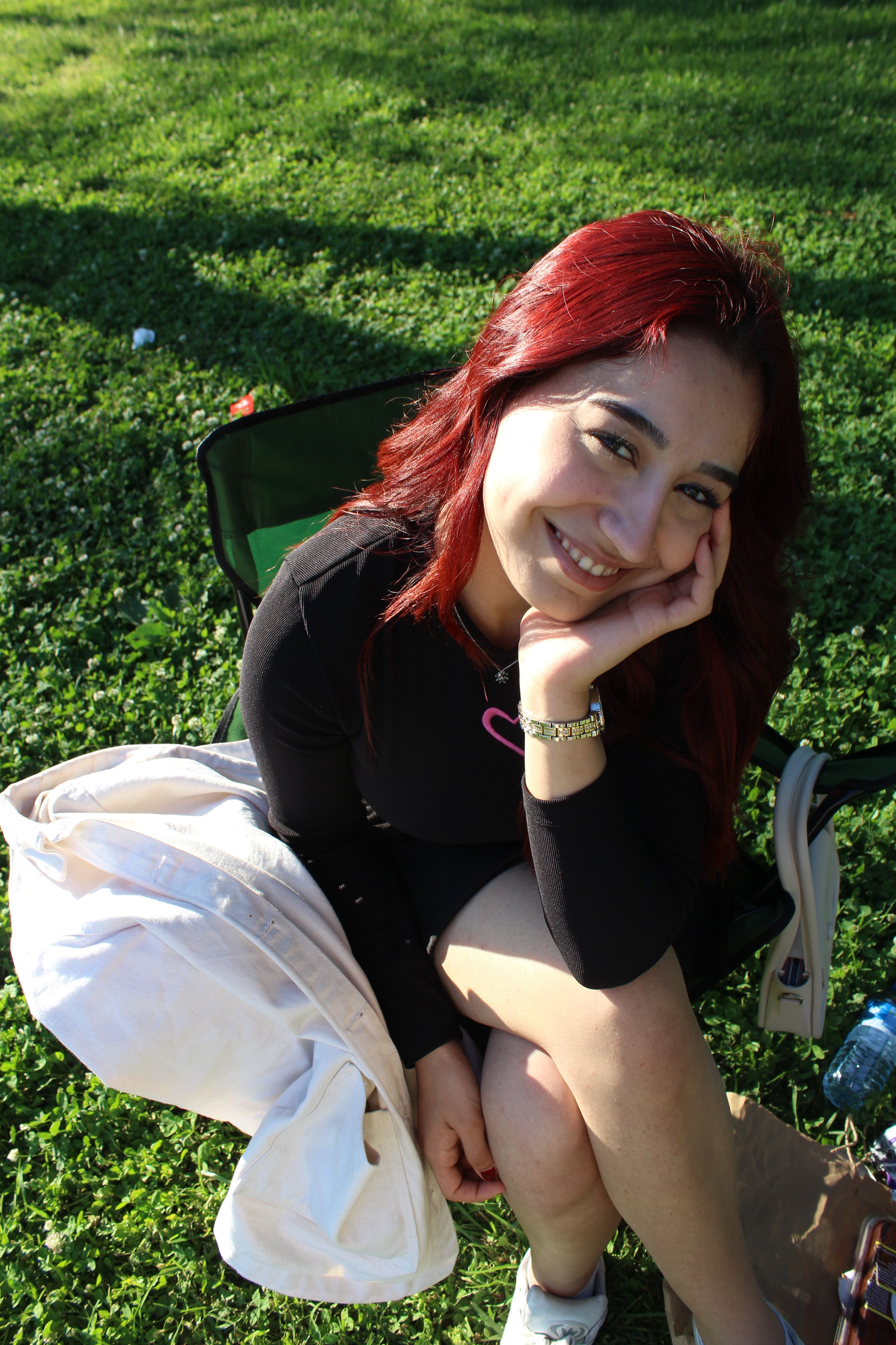 Young Woman Smiling Outdoors on a Sunny Day