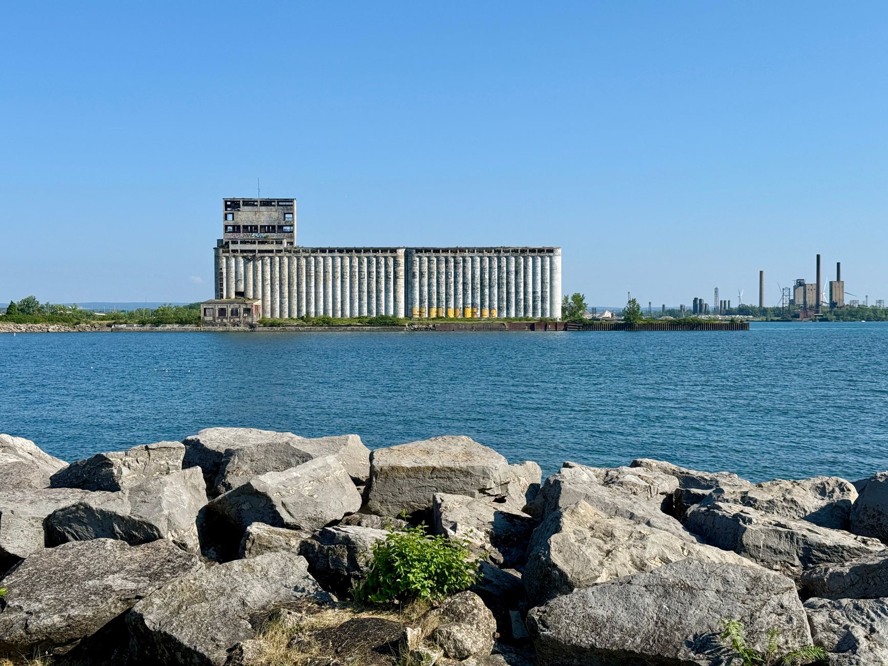 Door hanger delivery in Erie, PA Door hanger distribution and flyer delivery in Erie, PA — Lake Erie view with a grain elevator and industrial background in Buffalo, New York. above neighborhoods DoorBlitz crews walk