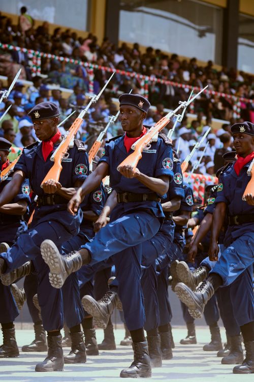 Free Soldiers in uniform perform a synchronized march during a military parade outdoors. Stock Photo
