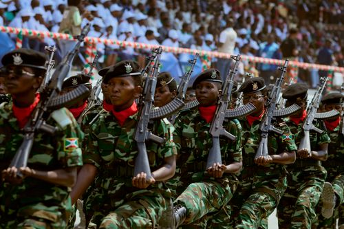 Free Soldiers in camouflage uniforms march in formation during a military parade. Stock Photo