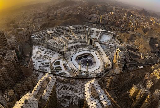 A stunning aerial view of the Grand Mosque in Mecca during sunset, showcasing its architecture.